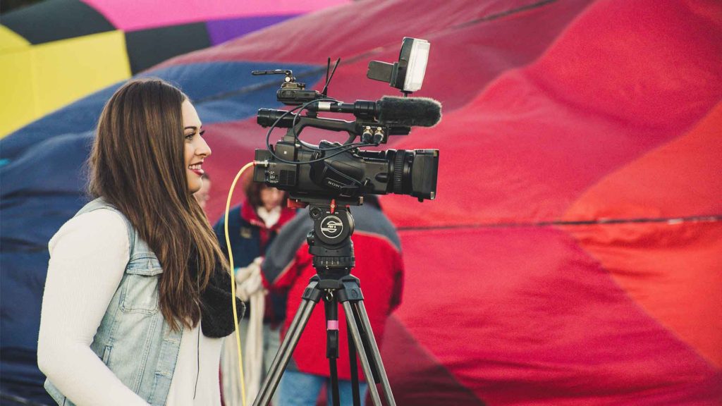 Woman holding video camera