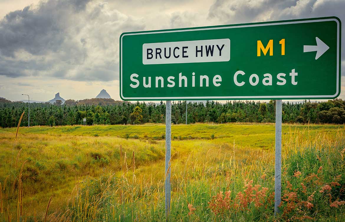 Road sign showing "Sunshine Coast"