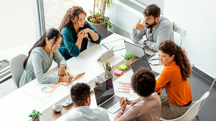 Marketing and sales teams aligning brand strategy in a workshop